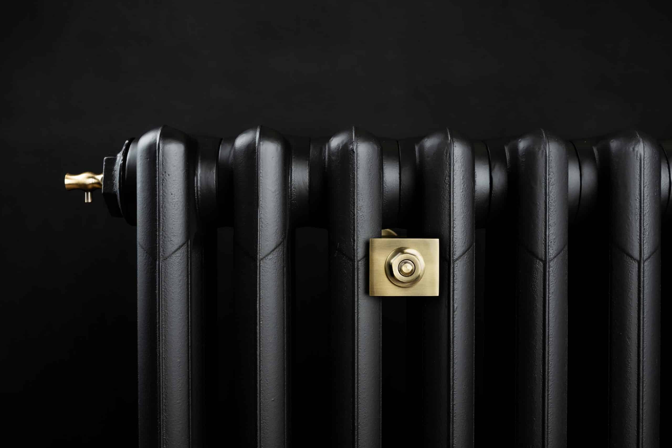 Black radiator against dark background